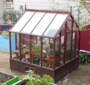 Small greenhouse with twinwall polycarbonate in roof, Glass walls
